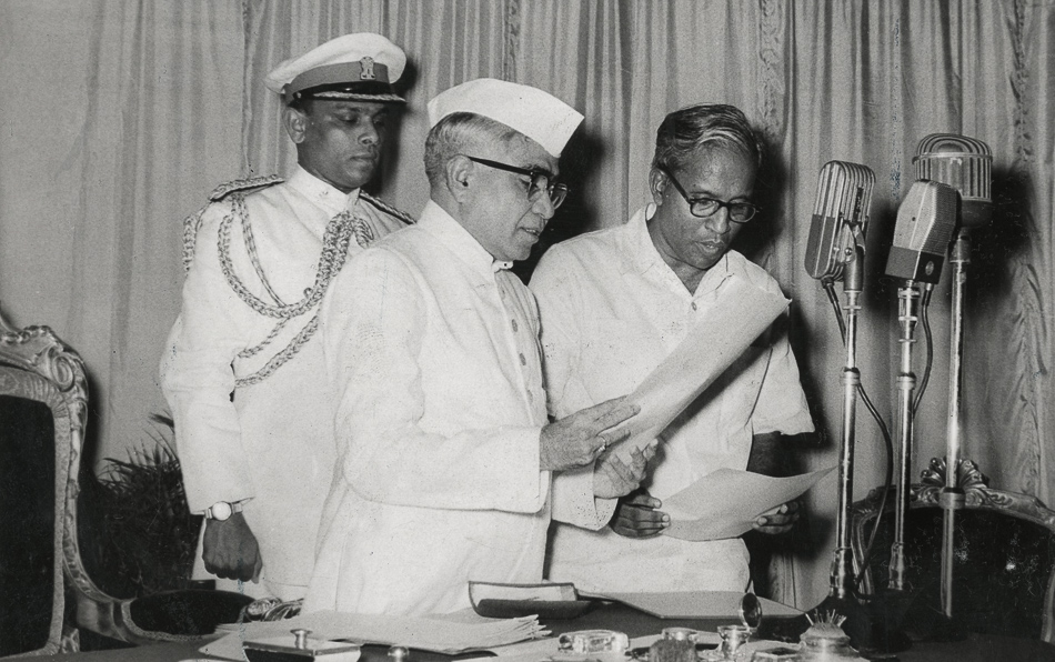 Caption: EMS Namboodiripad (right) taking oath as the first Chief Minister of Kerala. Thiruvananthapuram, 5 April 1957. Credit: Rajan Poduval / The Hindu Archives.