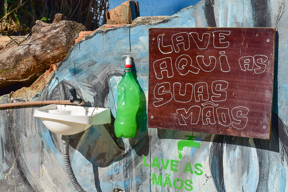 Faced with government neglect in favelas, collectives in Morro da Providência come together to install sinks with water and soap on the walls of the hillsides. Rio de Janeiro, Brazil, 2020. Douglas Dobby / Mídia Ninja